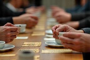 Guests sampling coffee at a cupping event