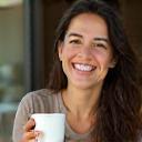 Elif Y. smiling with coffee